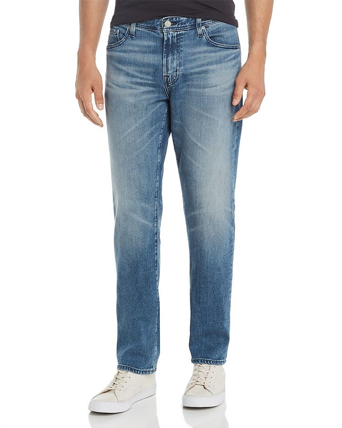 AG GRADUATE TAPERED FIT JEANS IN 16 YEAR SATURN,1174DAS