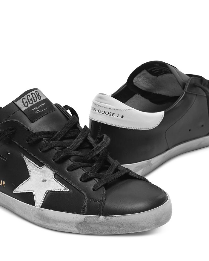 Golden Goose 'super-star' Black Low Top Sneakers With Logo Patch And Suede Details In Leather Man In Black/white