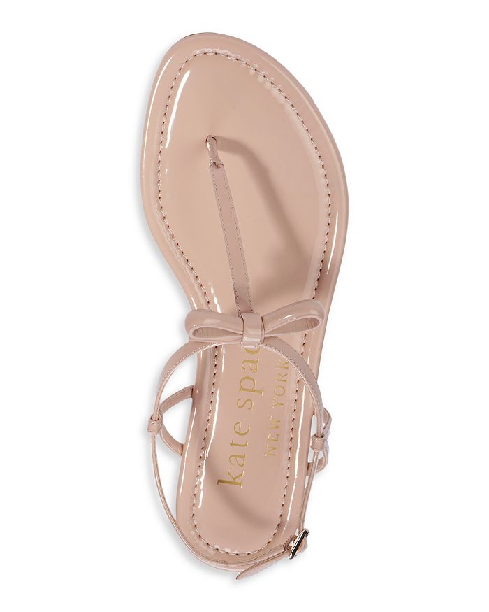 KATE SPADE KATE SPADE NEW YORK WOMEN'S PIAZZA KNOTTED BOW PATENT LEATHER THONG SANDALS