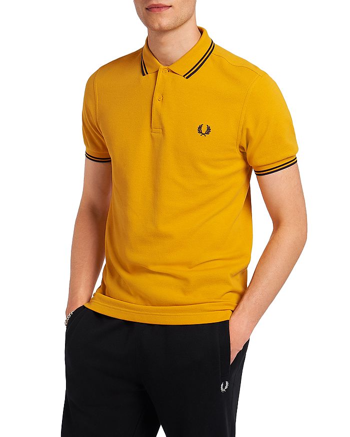 Fred Perry Twin Tipped Slim Fit Polo In Gold/french Navy