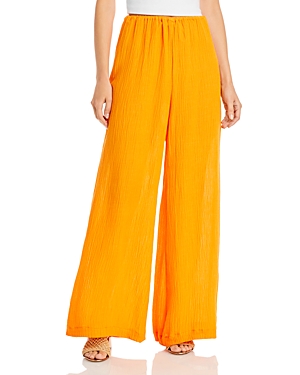 Faithfull The Brand Rupina Flare Leg Crinkle Pants In Tangerine