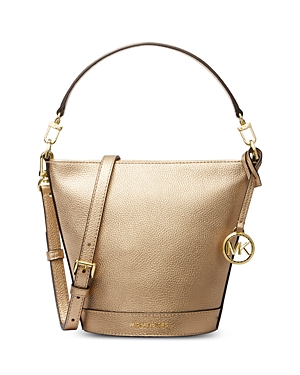 Shop Michael Kors Townsend Small Leather Convertible Bucket Crossbody In Pale Gold