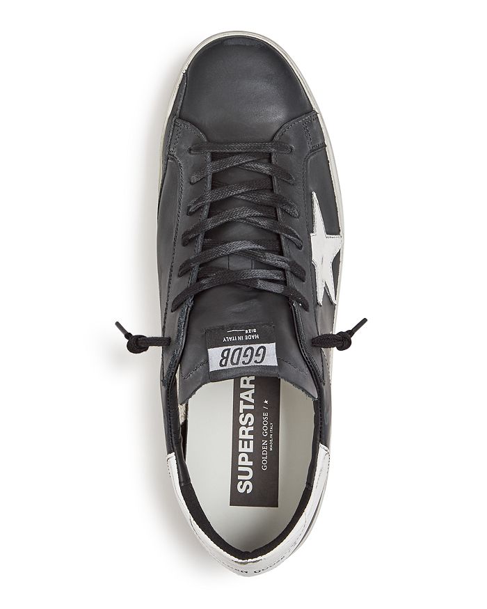 Golden Goose 'super-star' Black Low Top Sneakers With Logo Patch And Suede Details In Leather Man In Black
