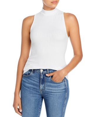 white sleeveless mock neck top