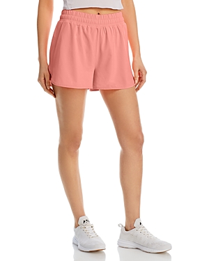BEYOND YOGA IN STRIDE LINED RUNNING SHORTS