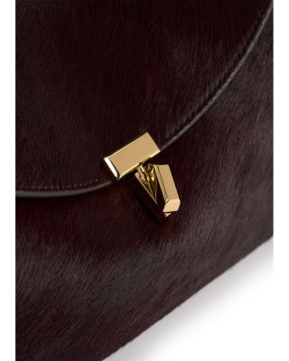 T Lock Calf Hair Convertible Clutch