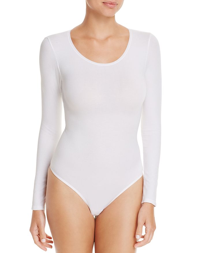 Shop Yummie Seamlessly Shaped Long Sleeve Bodysuit In White