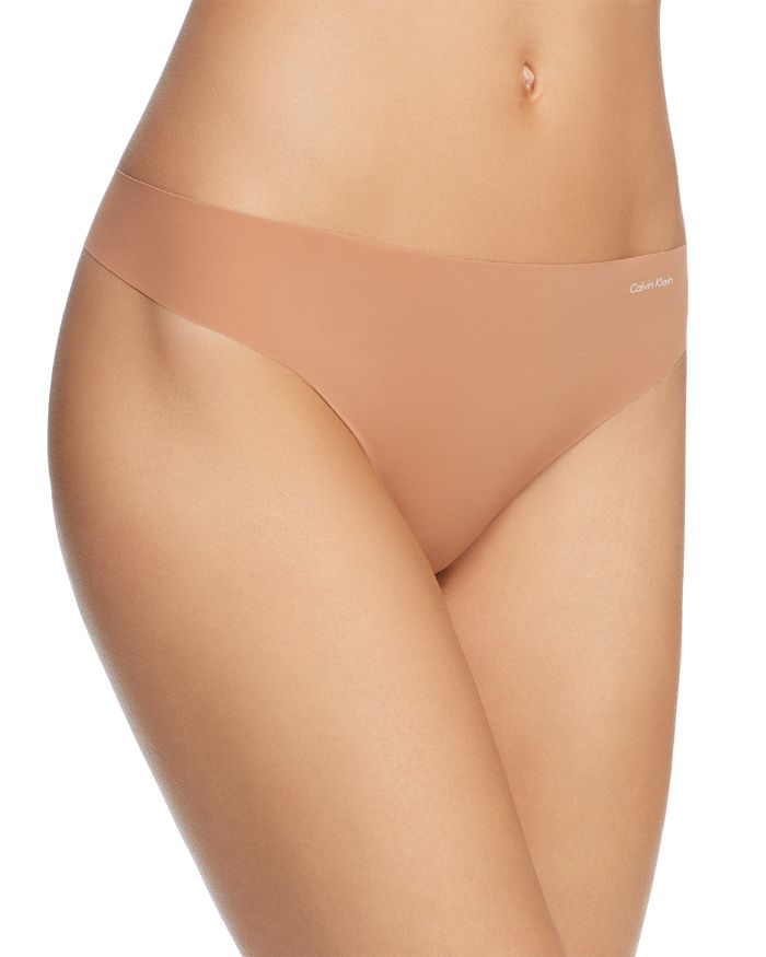 Calvin Klein Women's Invisibles Thong Underwear D3428 In Bronze