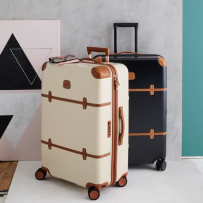 cream and brown luggage