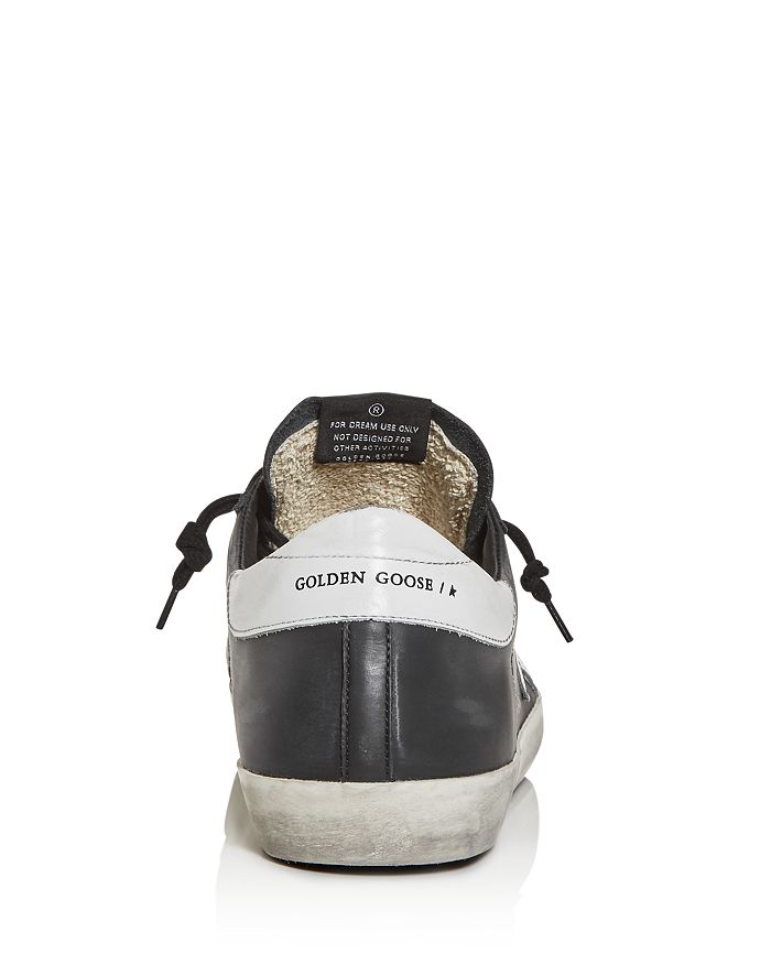 Golden Goose 'super-star' Black Low Top Sneakers With Logo Patch And Suede Details In Leather Man In Black