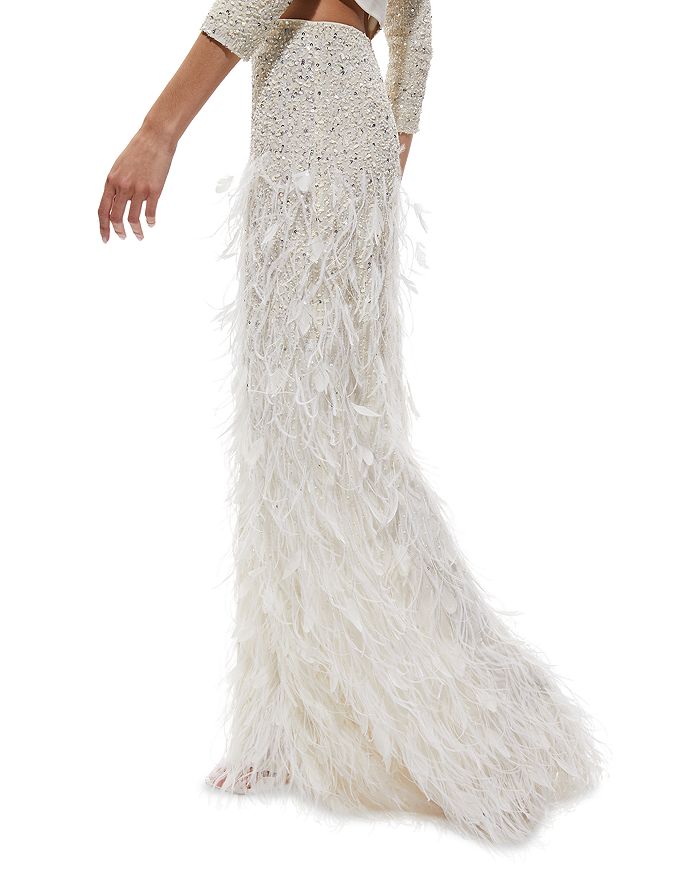 The white dress Mark Fast with sequins and ostrich feathers Cardi