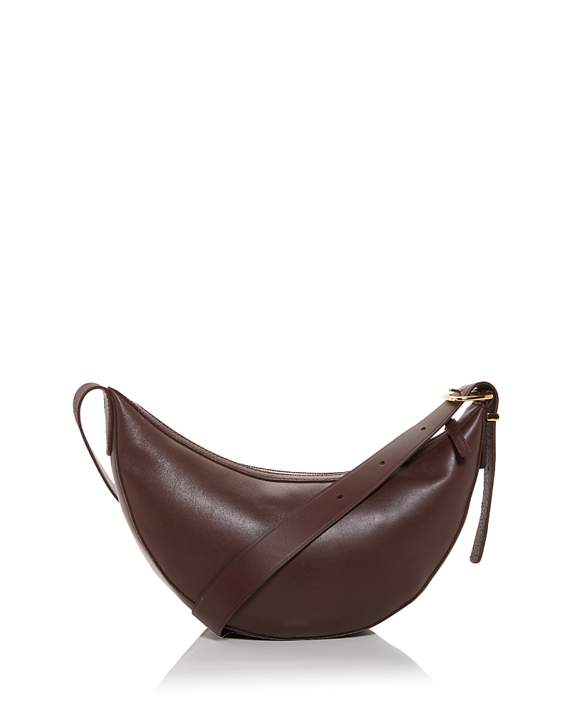 Shop Madewell The Essentials Crescent Sling In Leather In Chocolate