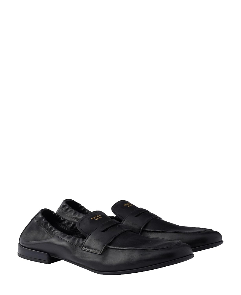 Prada Shuffle Antiqued Screen-printed-logo Loafers In Black