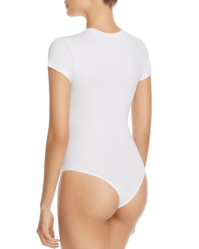 Shop Yummie Seamlessly Shaped Crew Neck Bodysuit In White