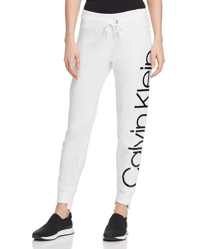 Calvin Klein Performance Step-hem Logo Sweatpants In White | ModeSens