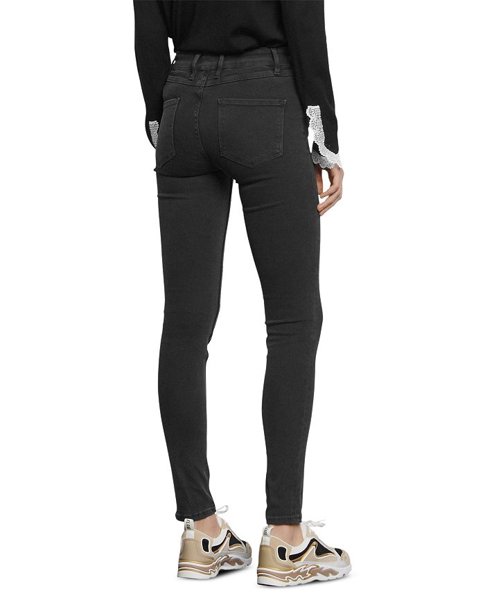 Shop Sandro Pam Mid-rise Skinny Jeans In Black