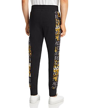 Womens Mens Clothing Mens Trousers Slacks and Chinos Casual trousers and trousers Versace Jeans Couture Synthetic Gold Branding Womens Leggings in White for Men 