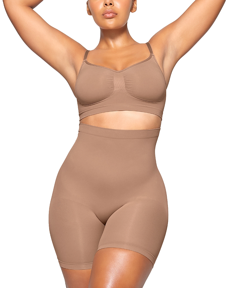Skims Seamless Sculpt Mid Thigh Shorts In Brown