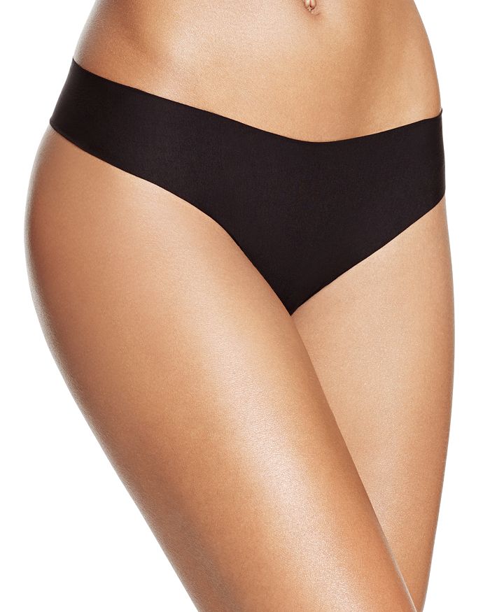 Shop Commando Butter Mid-rise Thong In Black