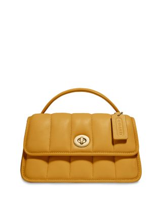 coach turnlock leather clutch