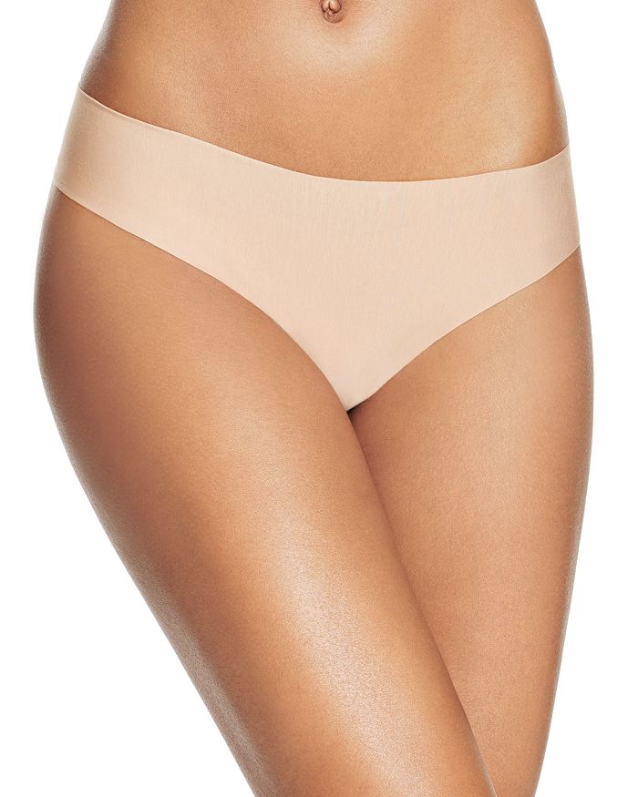 Shop Commando Butter Mid-rise Thong In Beige