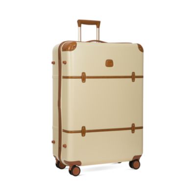 cream and brown luggage