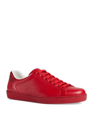 red bottom studded sneakers
