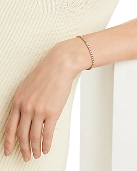 Rose gold plated Oval shaped Band with Demi lined moving Cubics cuff bracelet 
