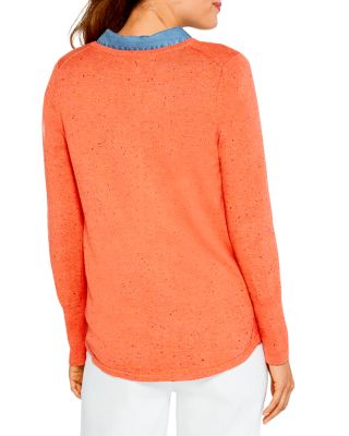 an orange sweater