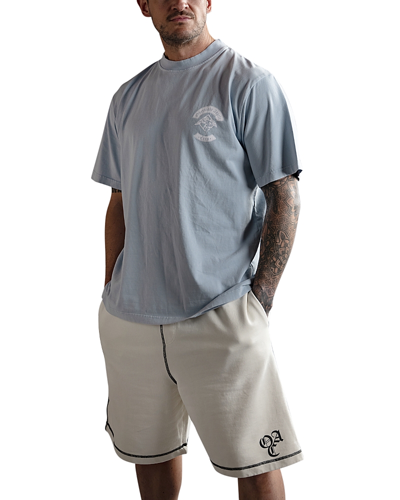 Overnight Angels Crew Crest Graphic Tee In Sky Blue