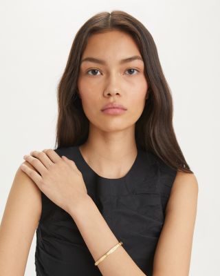 Miller Double T Studded Bangle Bracelet in Gold Tone Stainless Steel