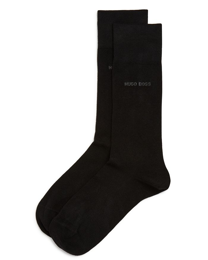 Shop Hugo Boss Edward Solid Dress Socks In Black