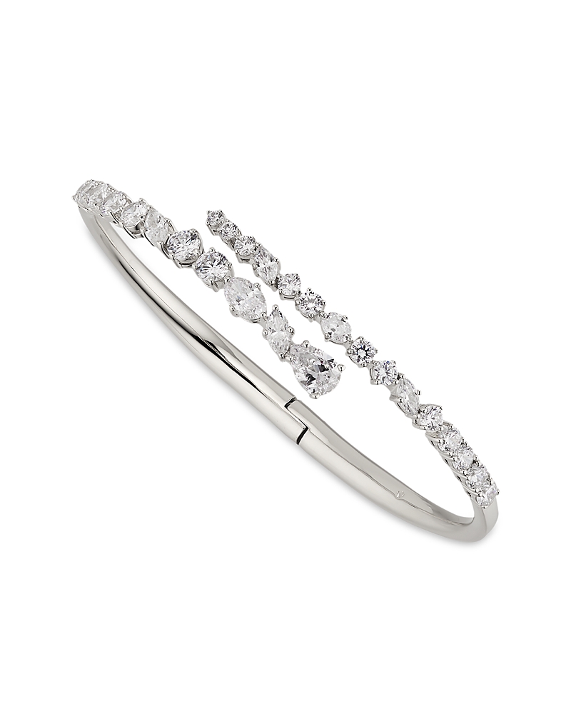 NADRI FLUTTER CUBIC ZIRCONIA BYPASS BANGLE BRACELET IN RHODIUM PLATED OR 18K GOLD PLATED