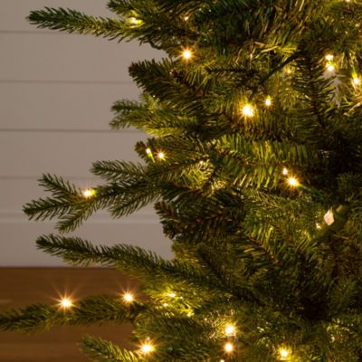 Pre-Lit Artificial 4.5&#39; Christmas Tree in Decorative Planter with Clear LED Lights