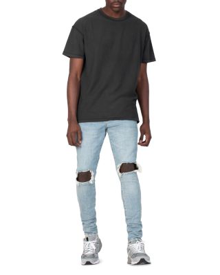 Dropped Slim Fit Destroyed Jeans in Light Indigo 