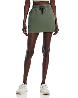 Shop Sweaty Betty Explorer Mini Skirt In Ivy Green