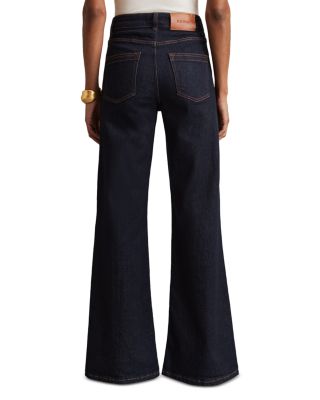 Petites Bonnie High Rise Flared Jeans in Dark Blue