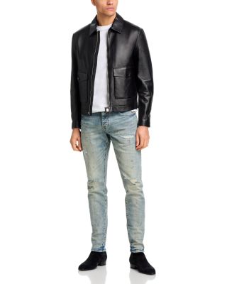 Worn Slashed Paint Jeans in Light Indigo