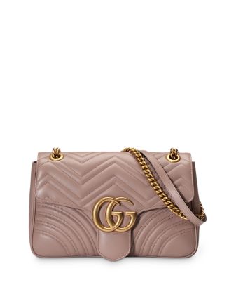 GG Marmont small shoulder bag in pink shearling