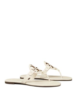 white designer flip flops