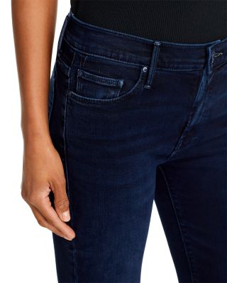 The Weekender Mid Rise Flared Jeans in Chip On My Shoulder