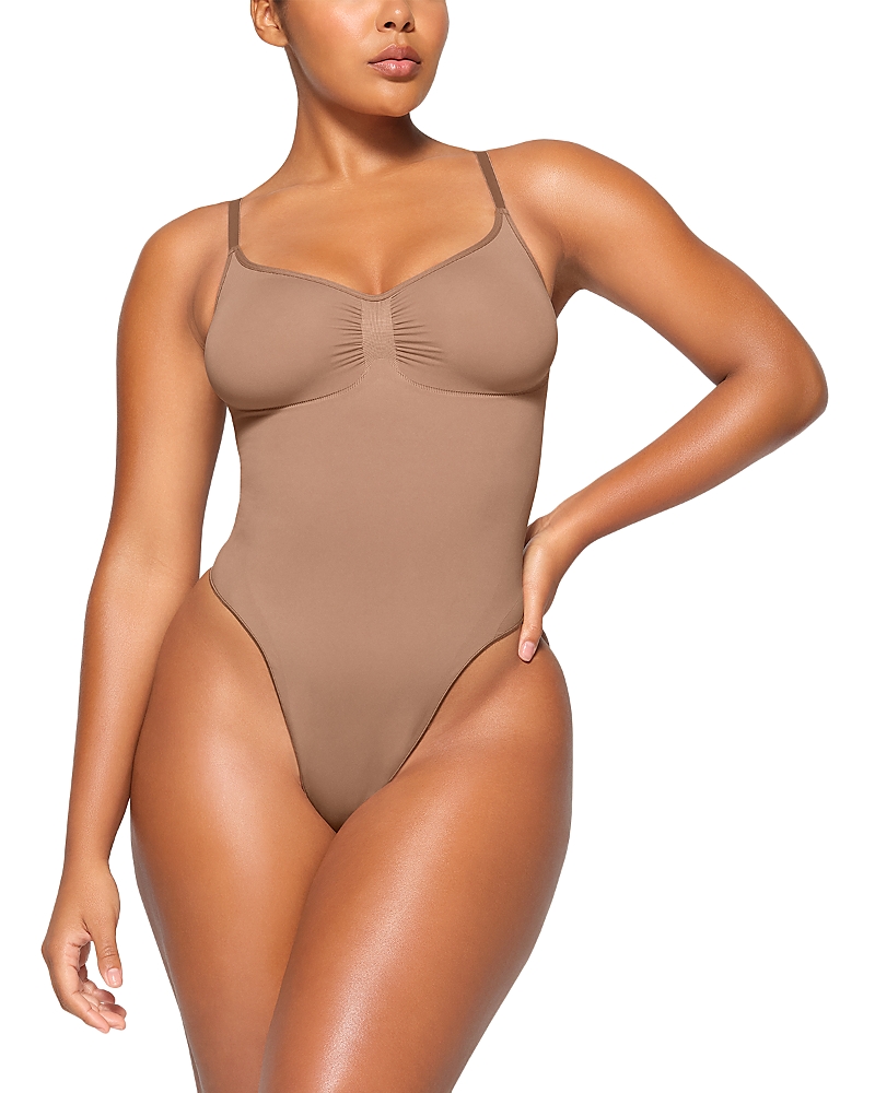 Skims Seamless Sculpted Brief Bodysuit In Brown