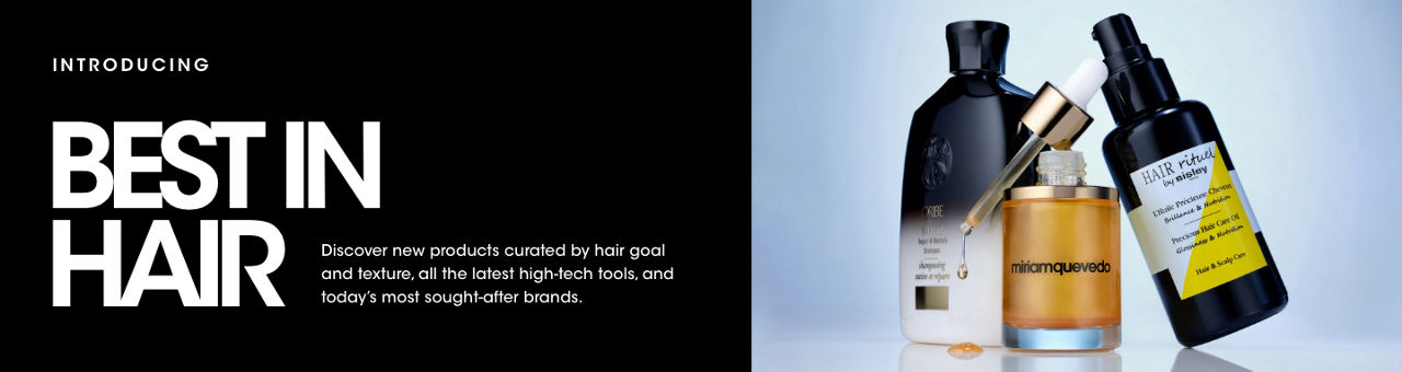 1 photo, of 3 products, an Oribe shampoo bottle, an open bottle of Miriam Quevedo serum, the dropper balanced on top dripping serum, and a tipped bottle of Sisley Paris Hair Rituel hair care oil.