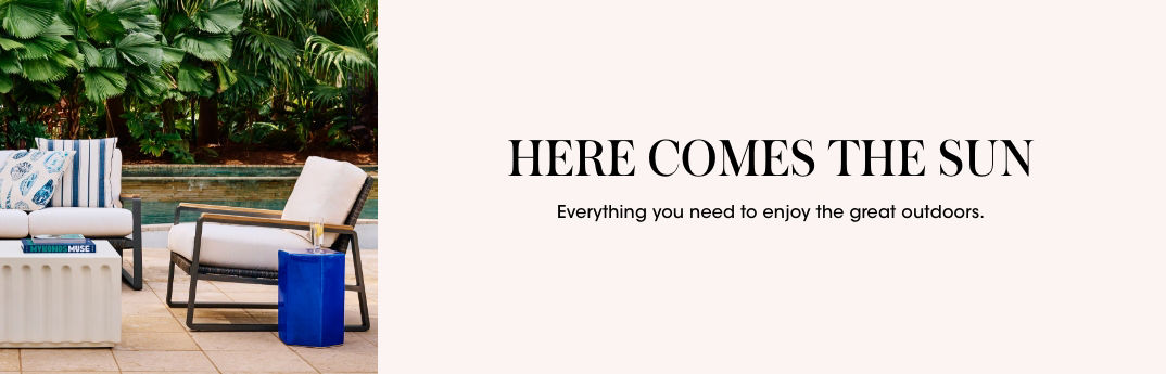 1 photo, of an outdoor lounge chair and sofa, white coffee table and bright blue side table on a patio next to a swimming pool, lush greenery in the background.