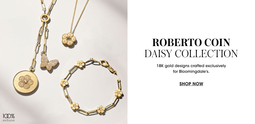 1 photo, of an 18 karat gold and diamond Roberto Coin Daisy collection double pendant necklace, a small daisy pendant necklace, and a five station daisy bracelet, all lying flat.