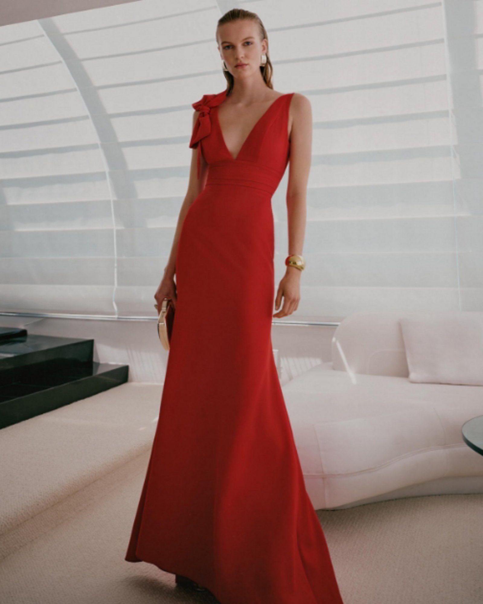 1 photo of female model in red evening gown.