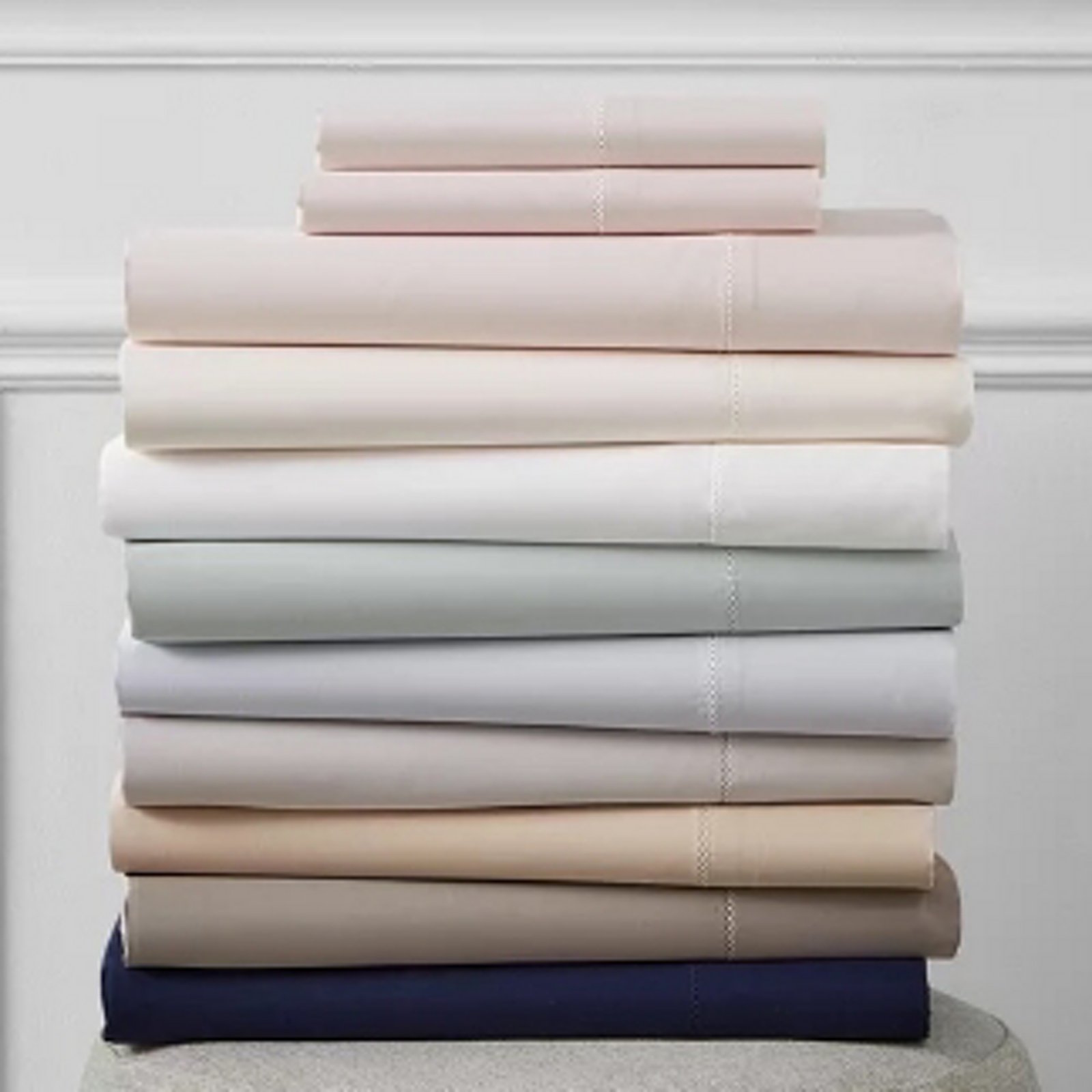 1 photo of a stack of Hudson Park sheets.