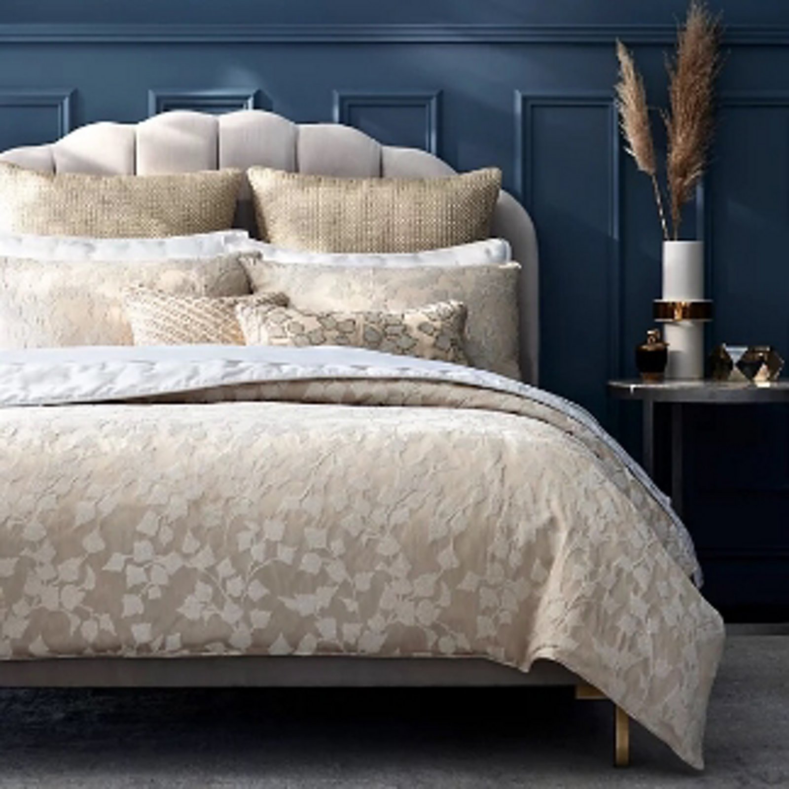 1 photo of bed with Hudson Park duvet covers and pillow shams.