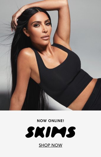 1 photo of Kim Kardashian in 2 piece black sports top and black shorts.