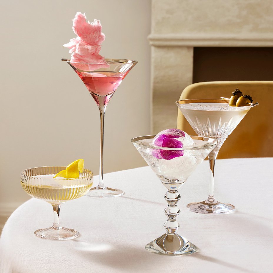 A variety of martini glasses, coupes, and other glassware.